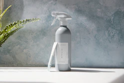 white plastic pump bottle on white table