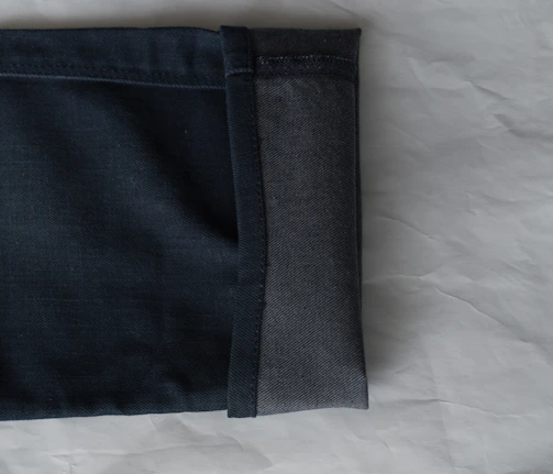 Close-up of oversized cargo shorts with detailed stitching in natural city light.
