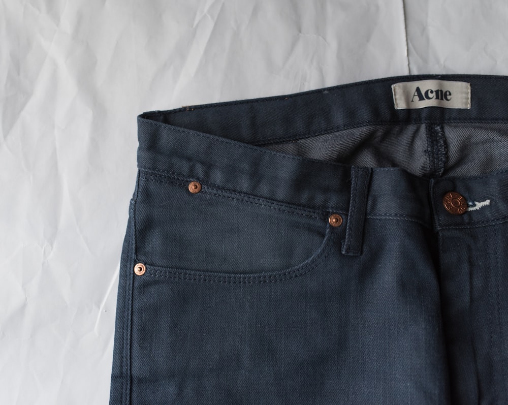 blue denim bottoms on white textile