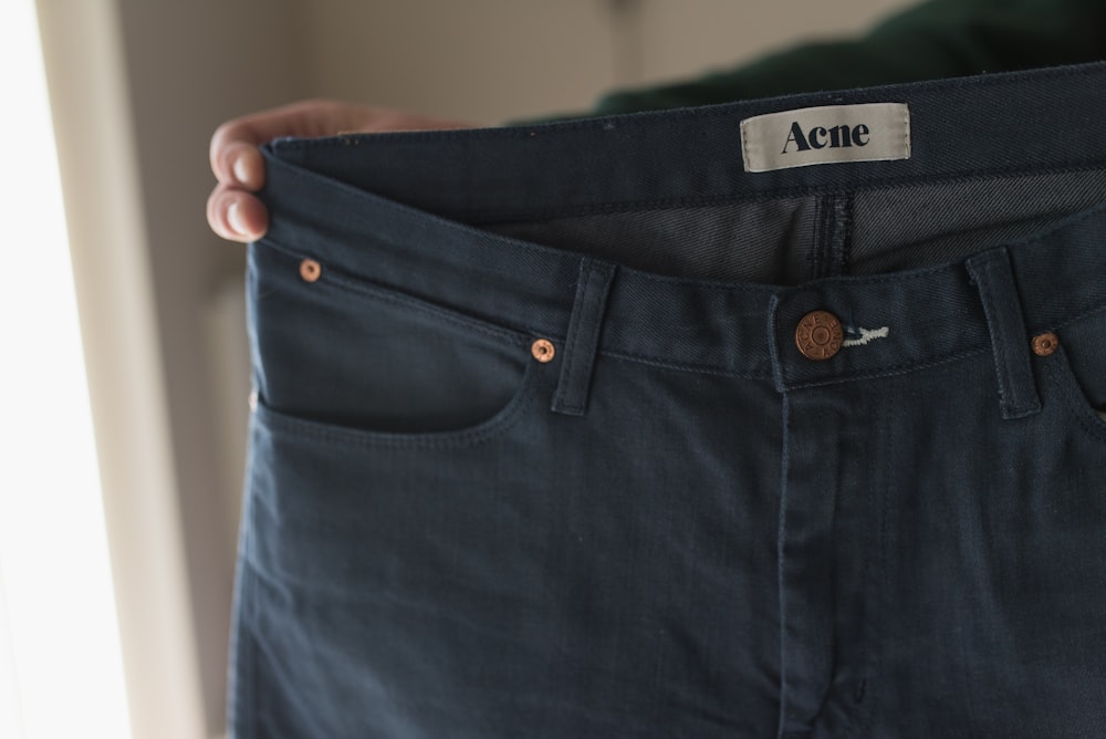 blue denim bottoms on white table