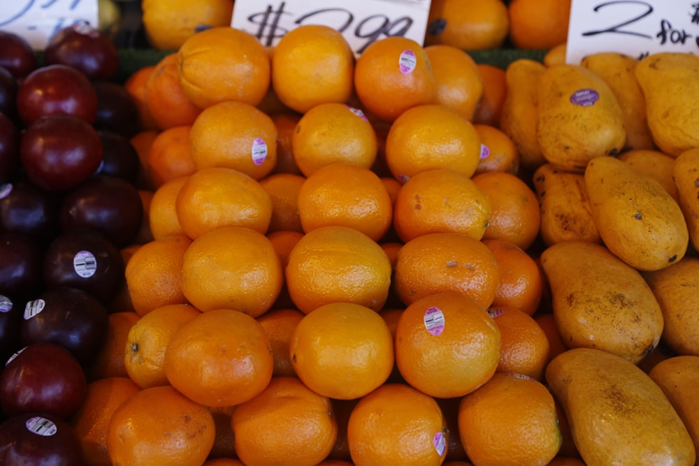 orange fruits on white plastic container
