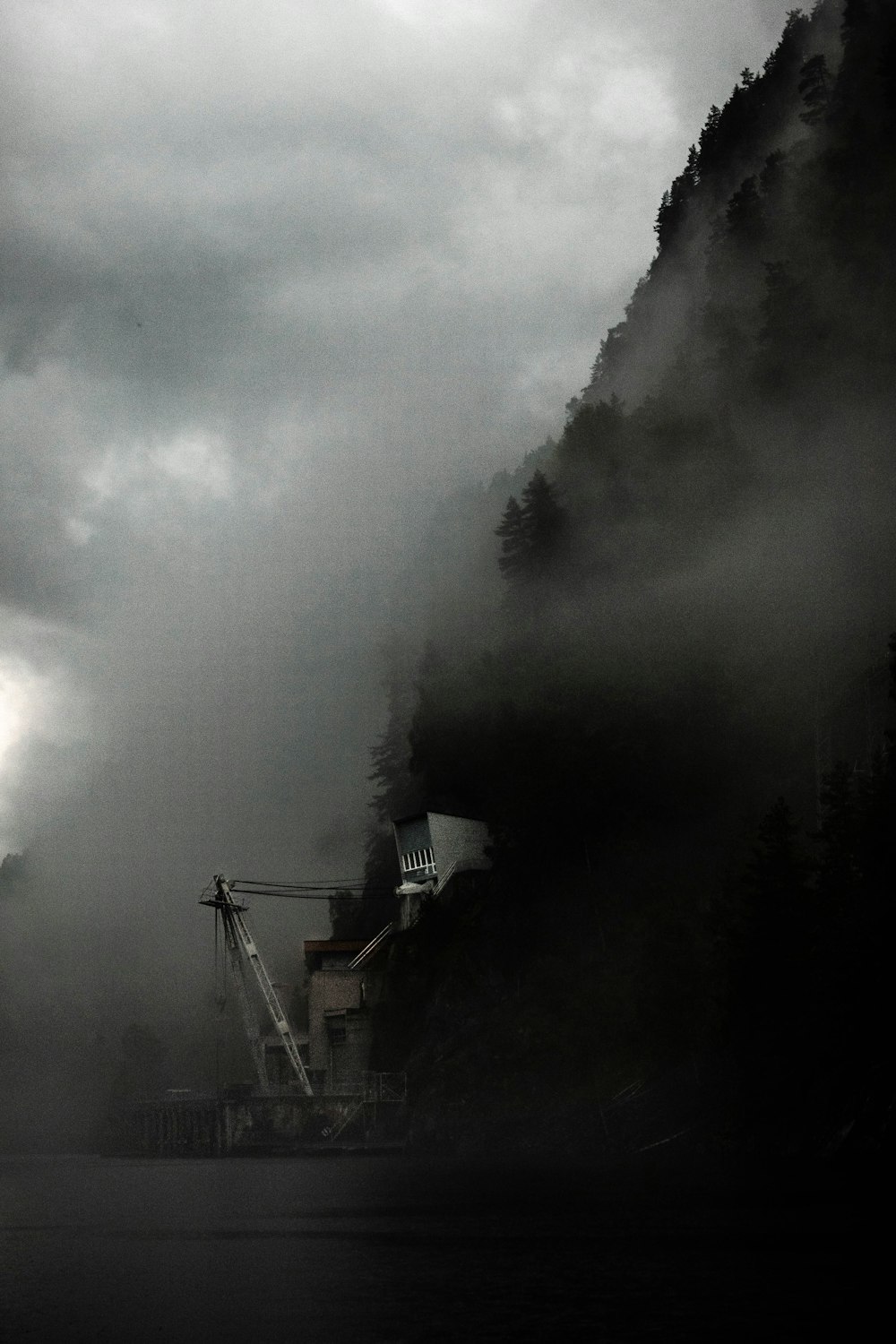 white and black house on top of the mountain