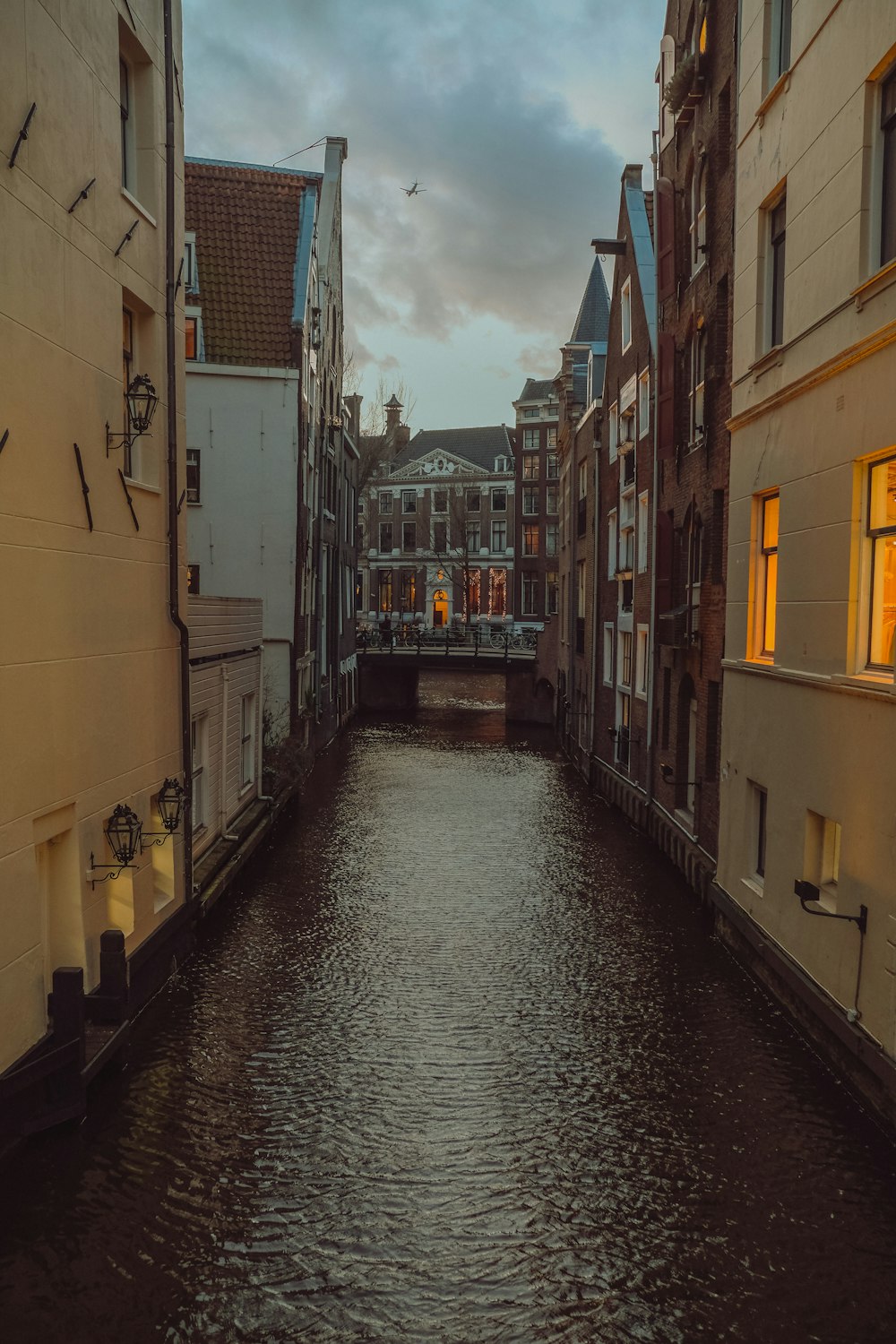 river between brown concrete buildings during daytime