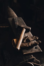 brown wooden rolling pin on black surface