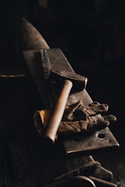 brown wooden rolling pin on black surface