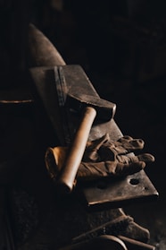 brown wooden rolling pin on black surface