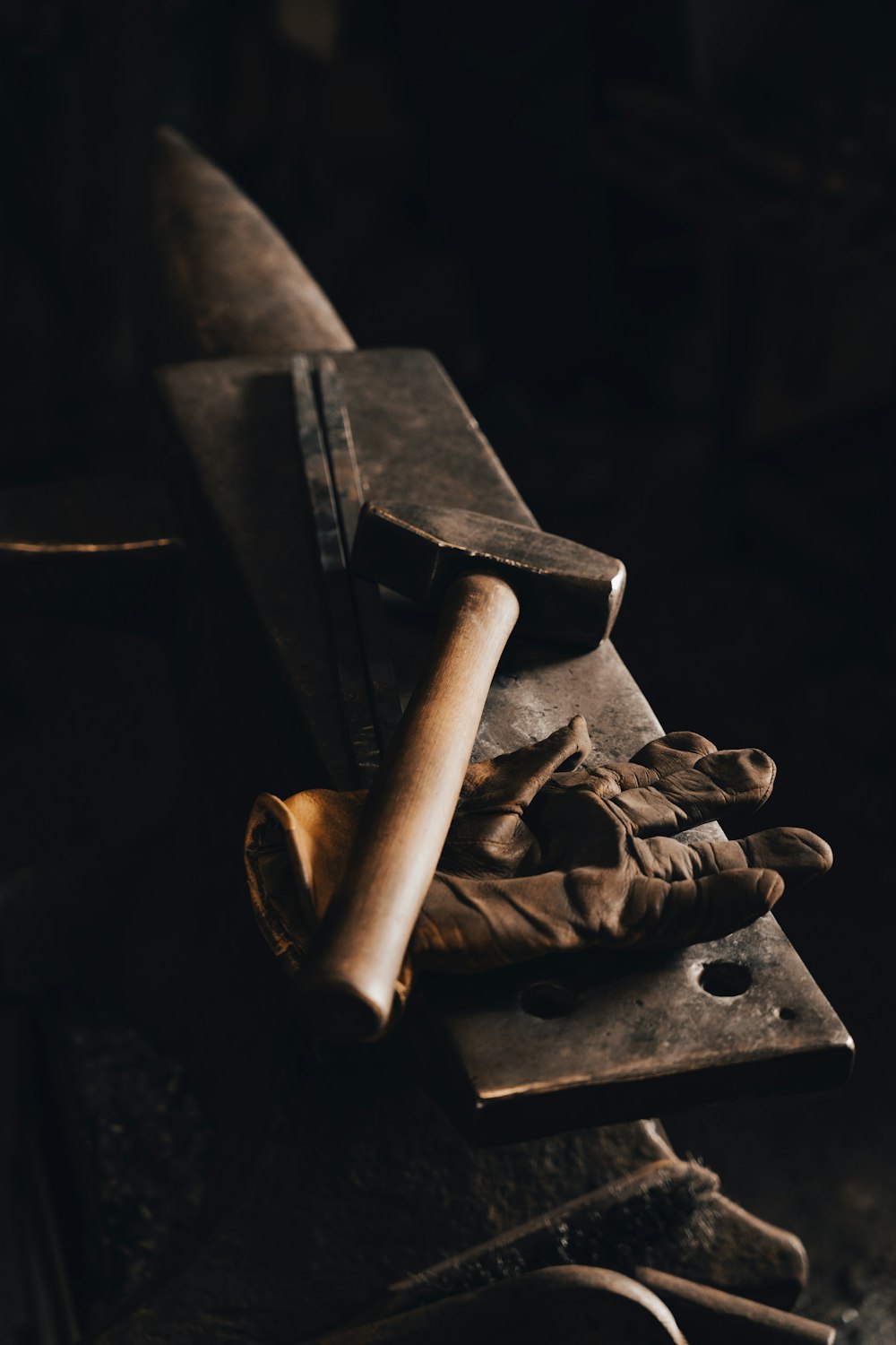 brown wooden rolling pin on black surface