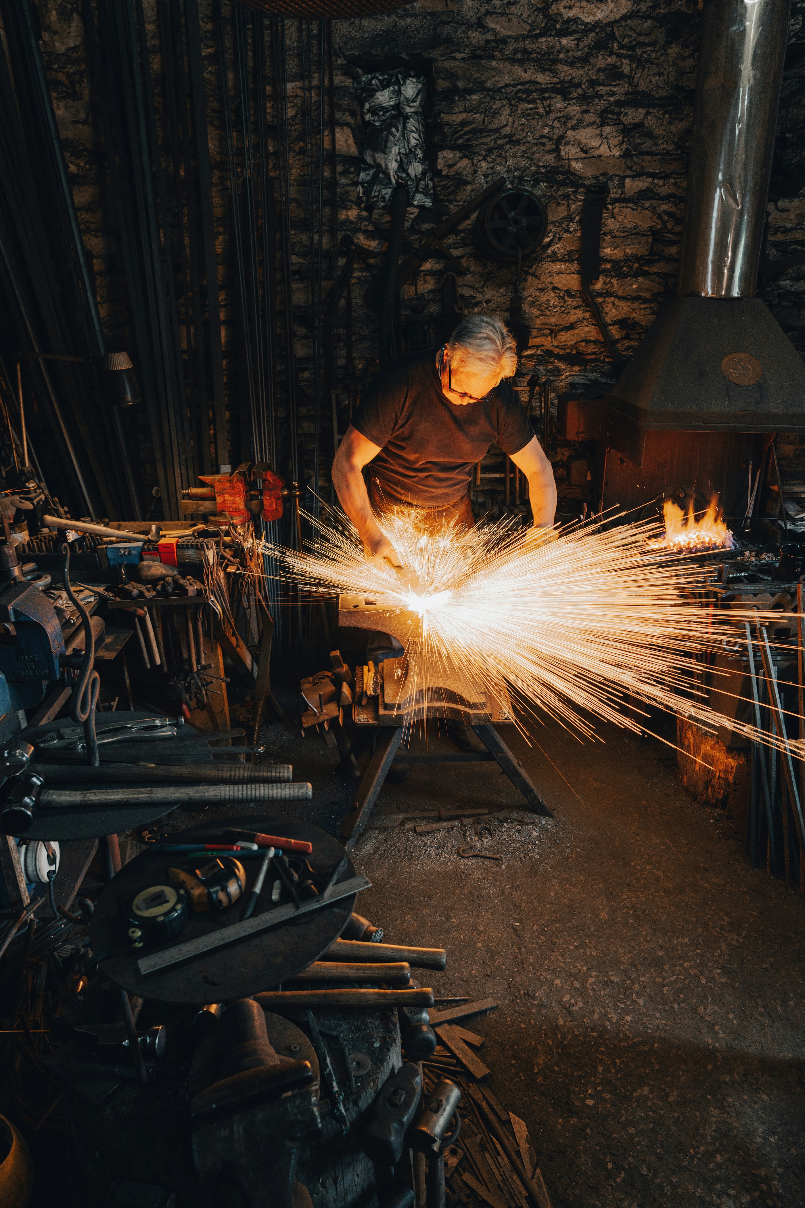 man in brown shirt holding fire
