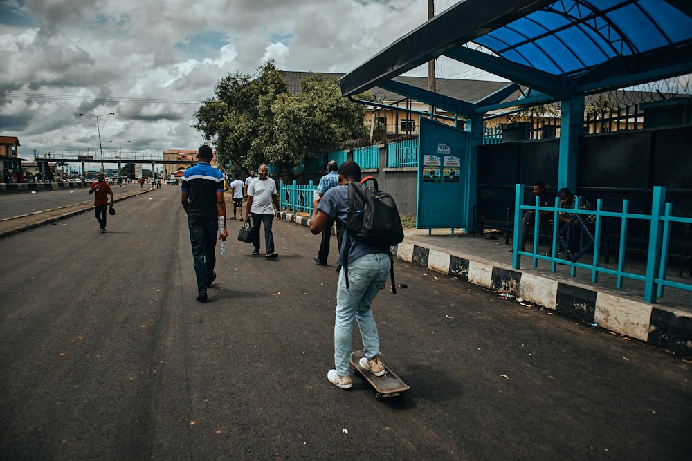 people walking on sidewalk during daytime