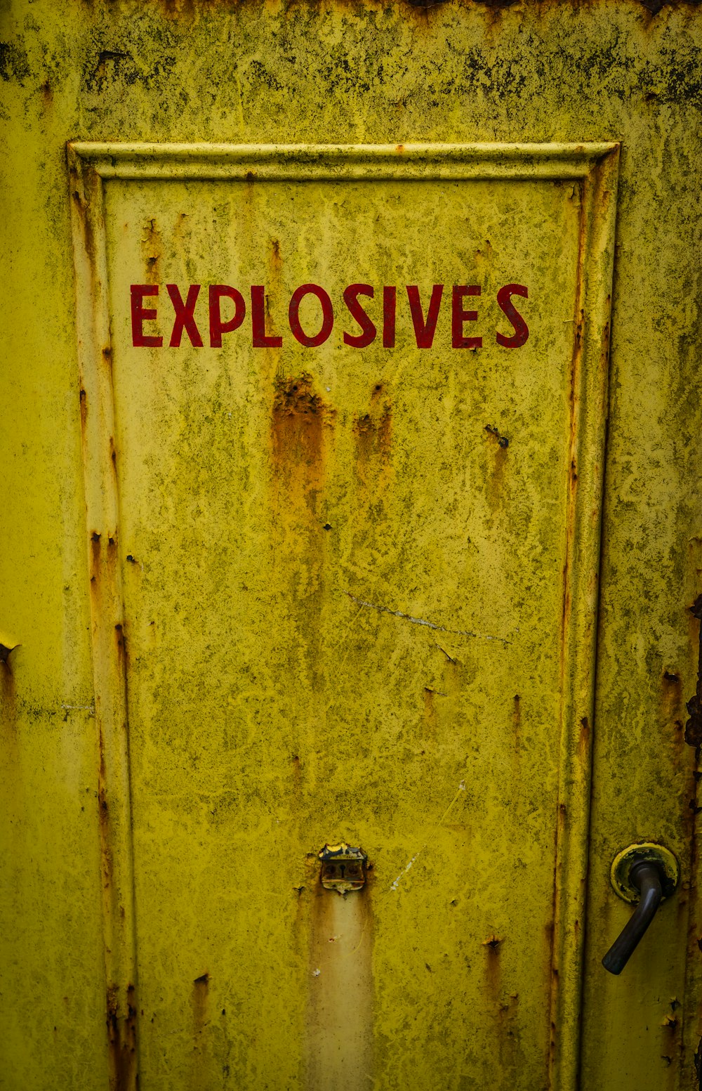 yellow wooden door with red and white no smoking sign