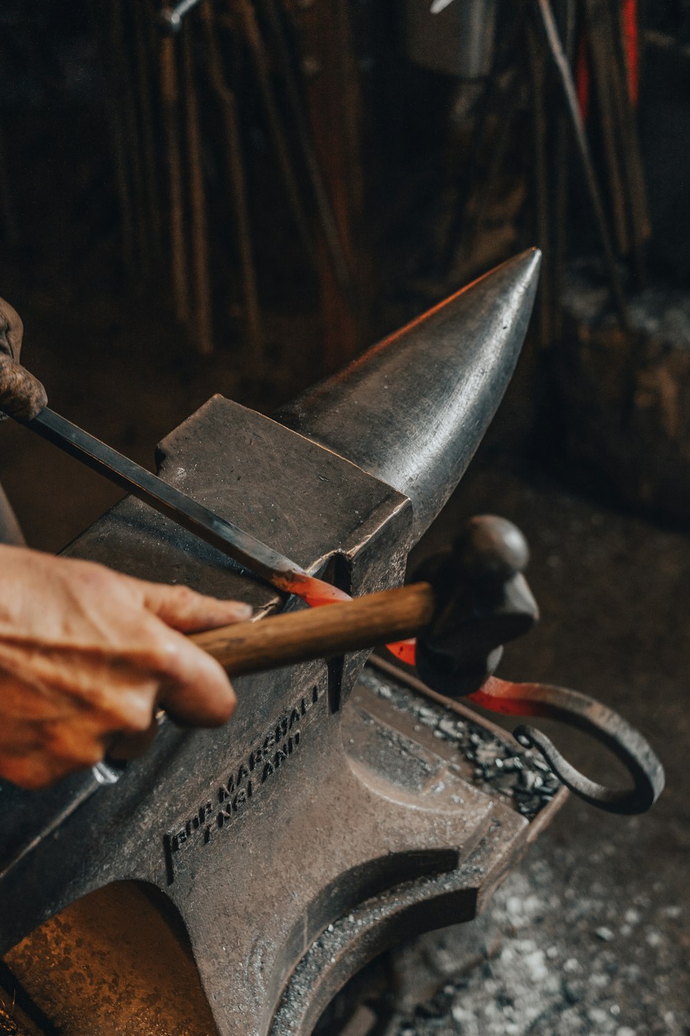 person holding a brown and black metal hand tool