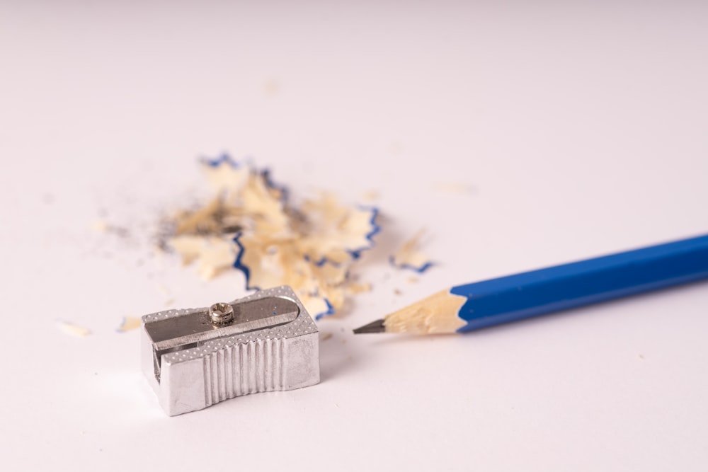 blue pencil sharpener on white surface