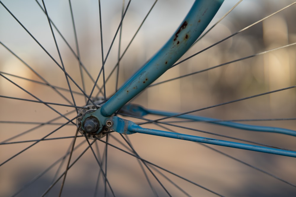 blue bicycle wheel in close up photography