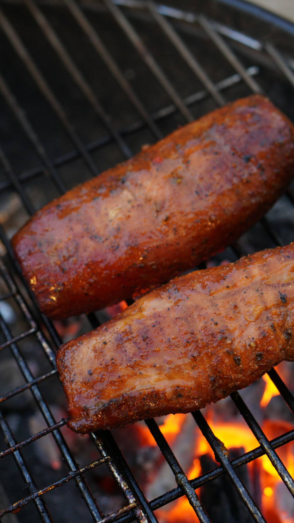 grilled sausage on black metal grill