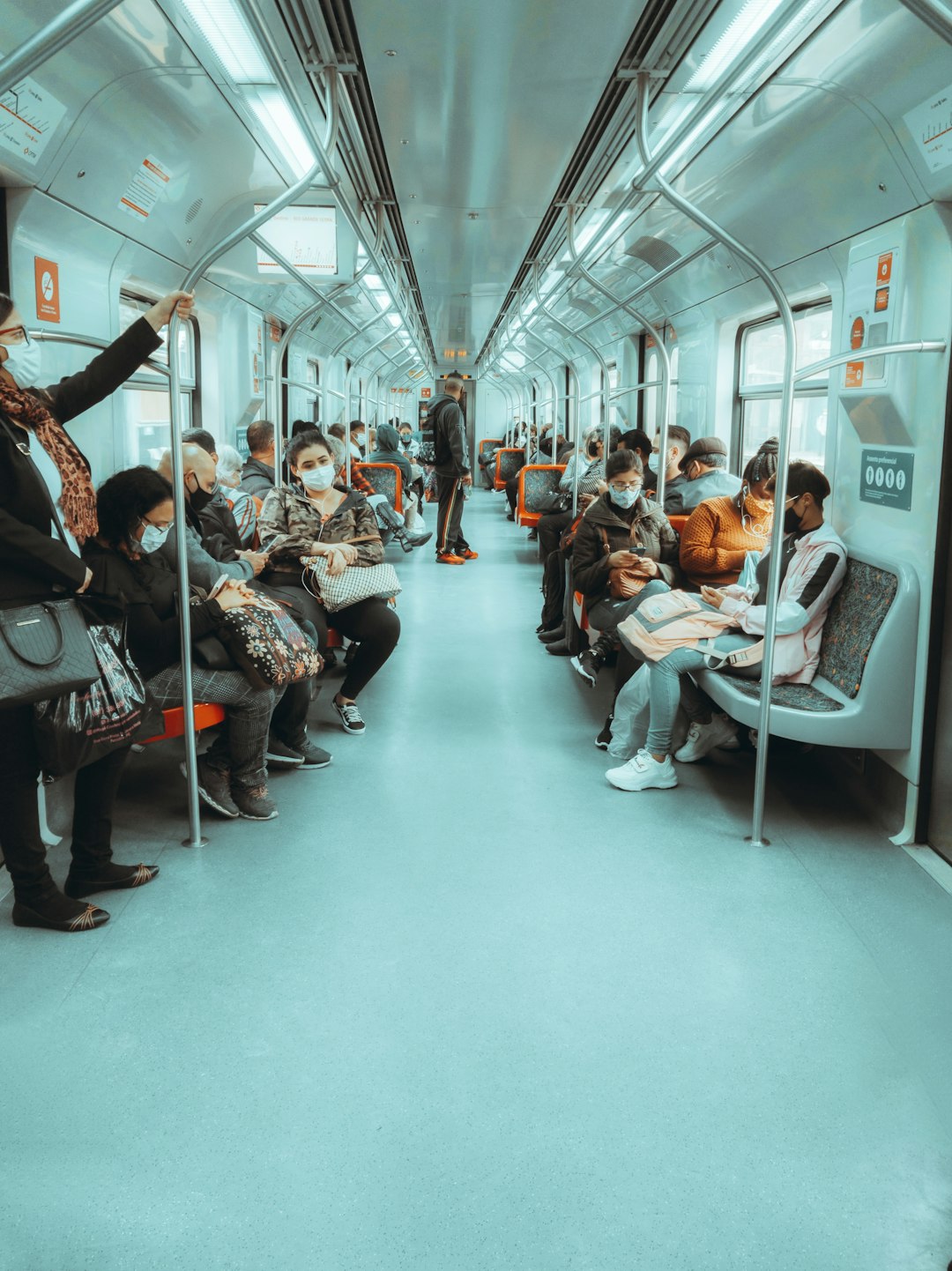 people sitting on white chair inside train