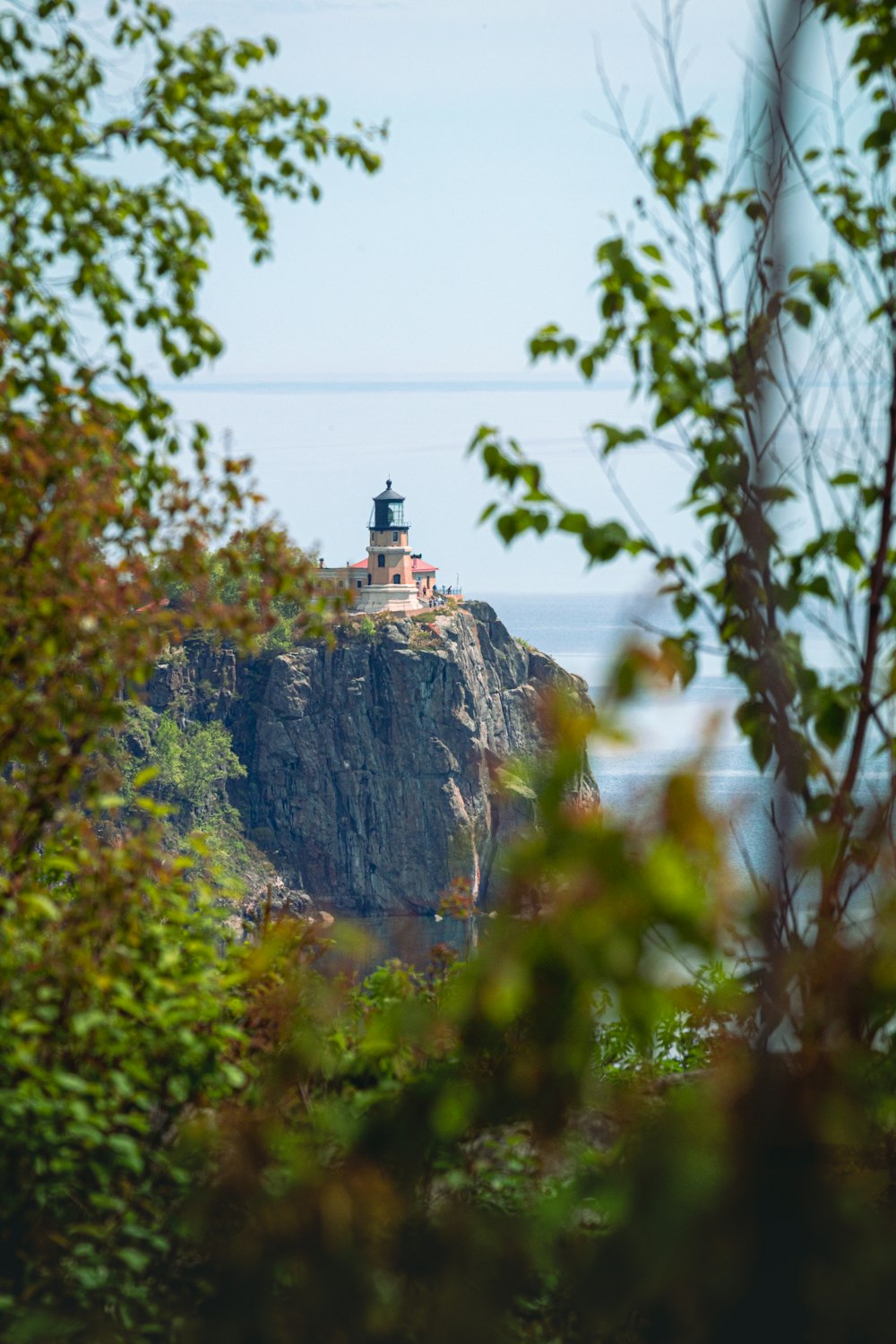 a small light house on top of a cliff