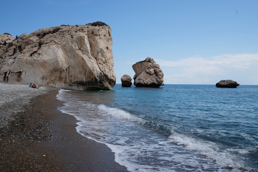 brown rock formation on sea shore during daytime