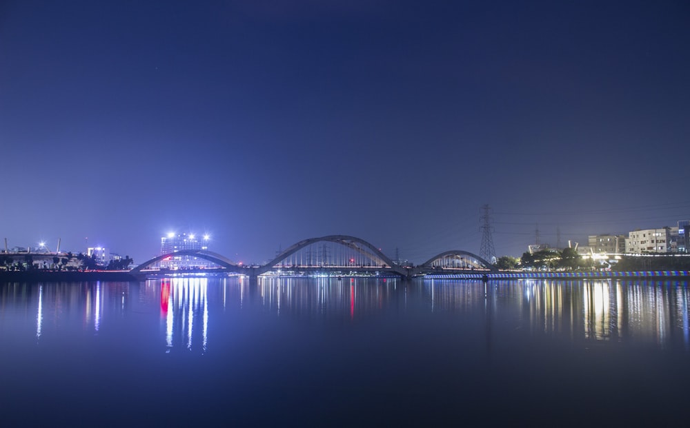 bridge over water during night time