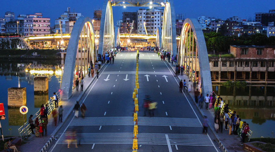 The Hatirjheel bridge in Dhaka at dusk, lit along its arches
