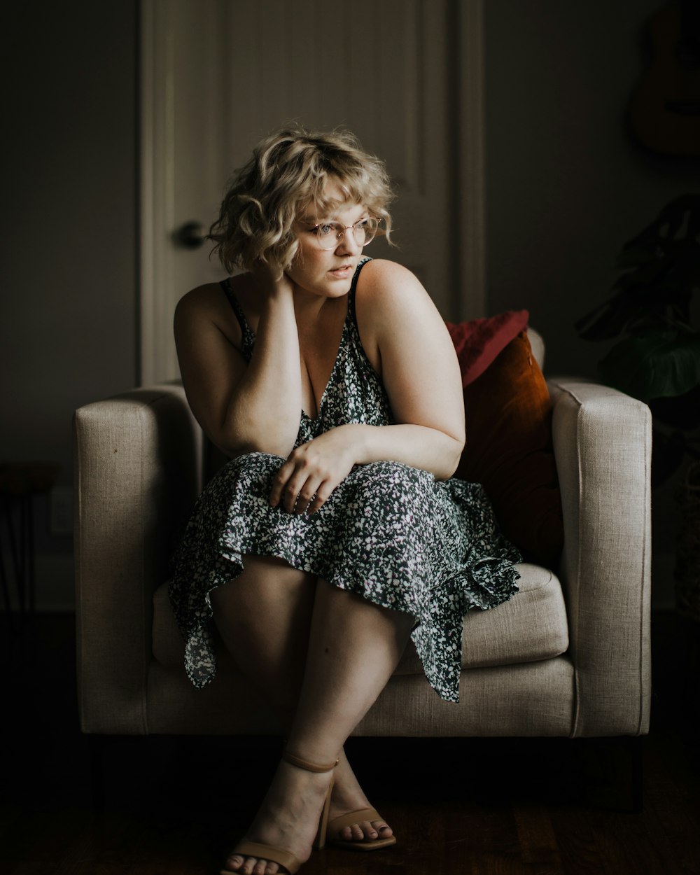 woman in black and white dress sitting on couch