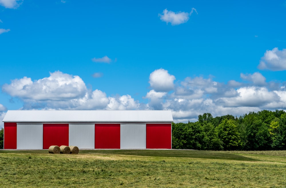 red and white barn under blue sky during daytime