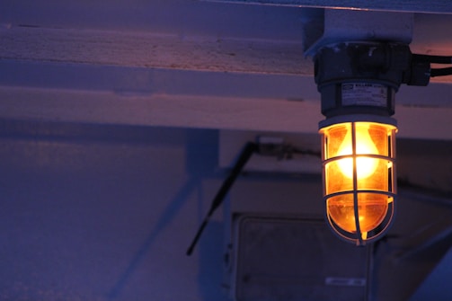 black and yellow lamp turned on in room