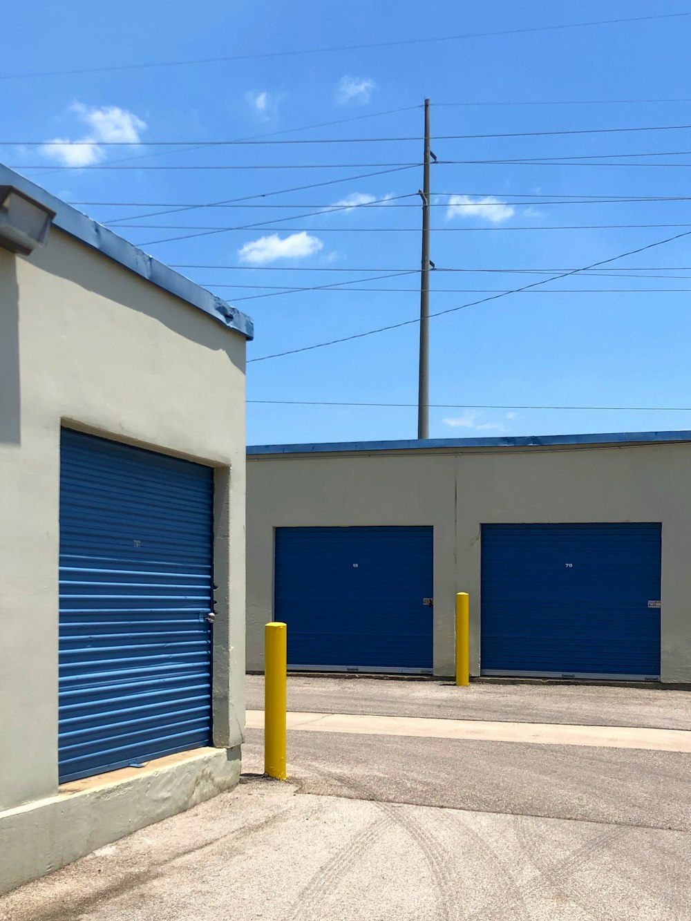 blue and white concrete building under blue sky during daytime