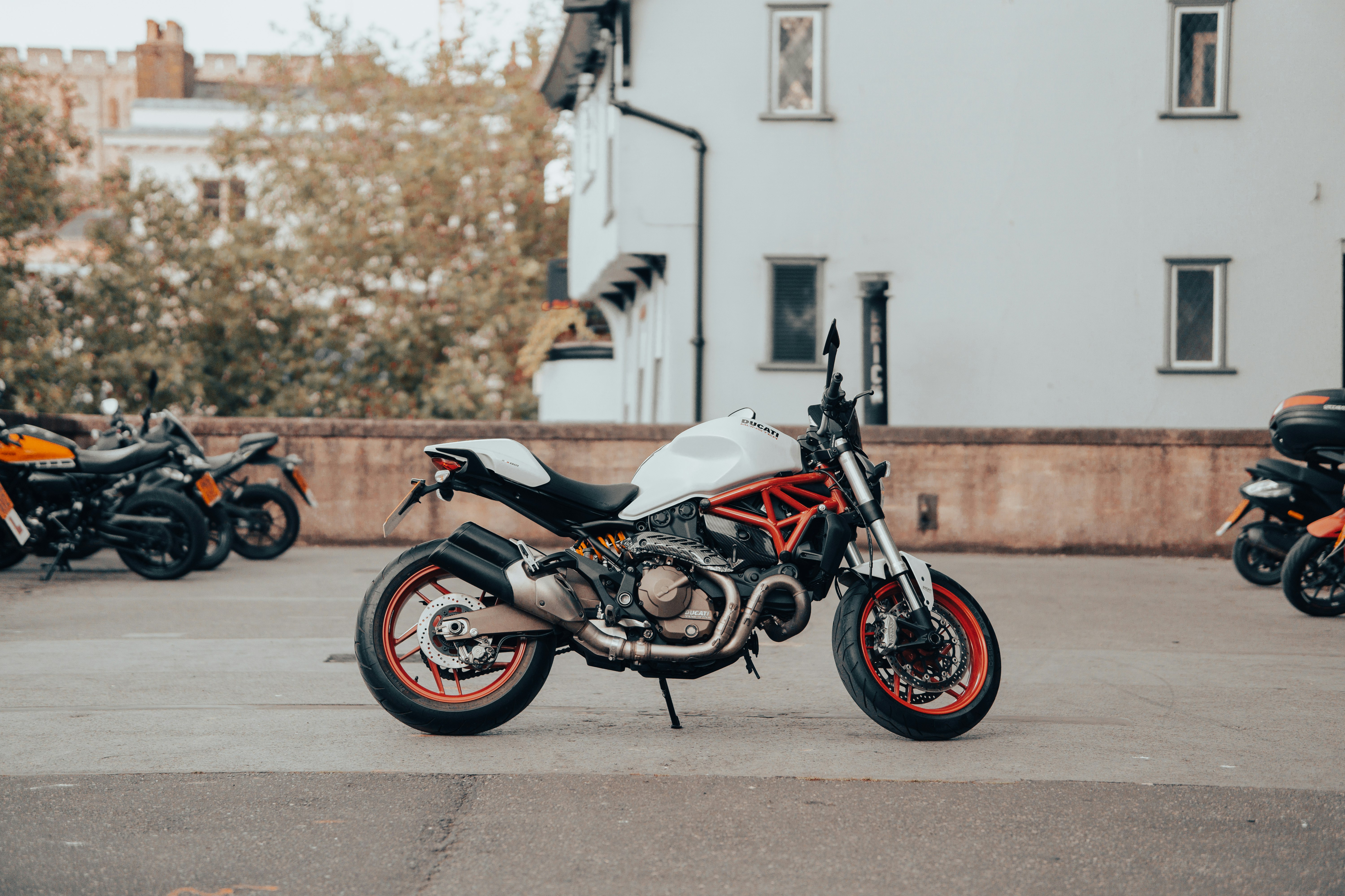 black and red naked motorcycle parked on the street