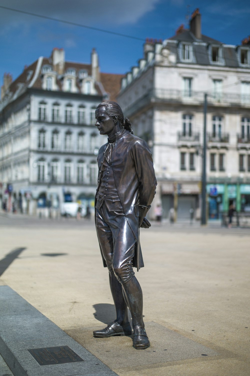 man in black leather jacket and pants statue