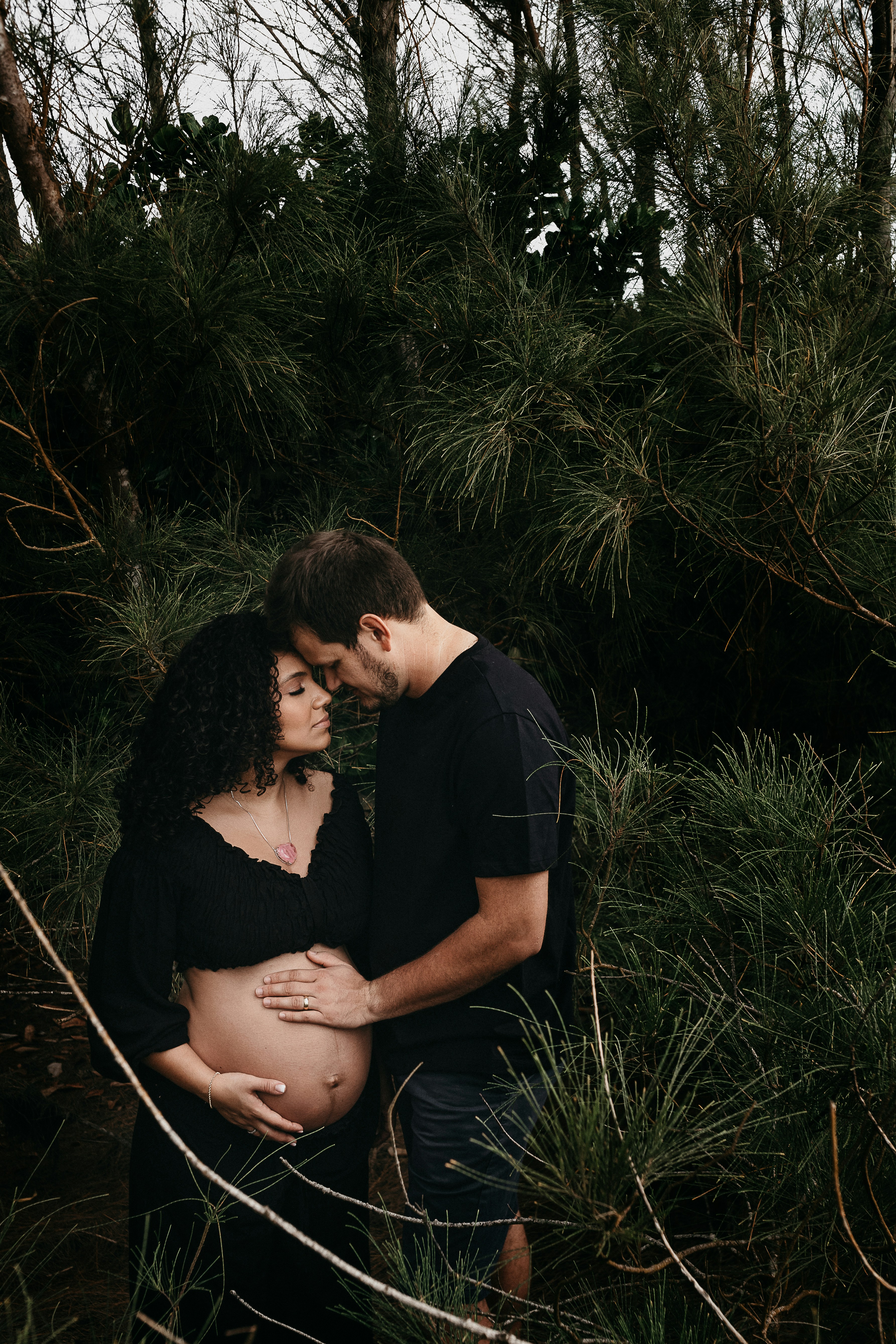 man in black crew neck t-shirt kissing woman in black t-shirt