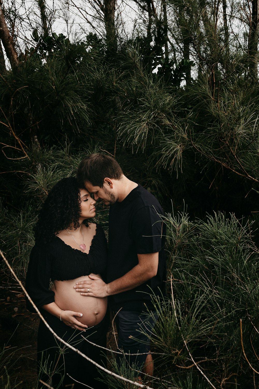 man in black crew neck t-shirt kissing woman in black t-shirt