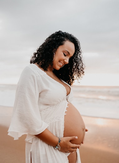 Pregnant woman holding belly