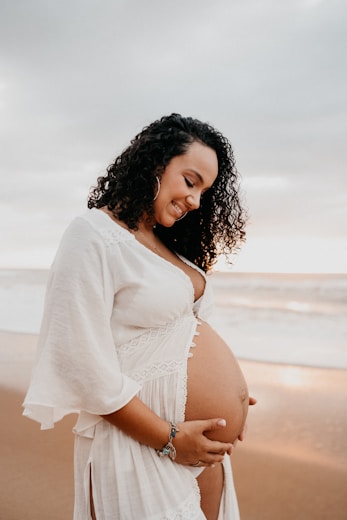 Pregnant woman holding belly