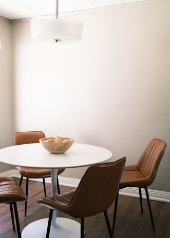 Cozy dining area with sleek table and chairs featuring contemporary design elements.