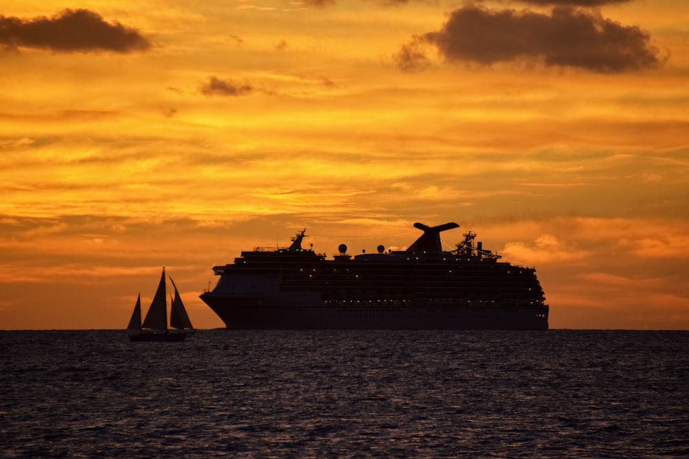 white and black cruise ship on sea during sunset