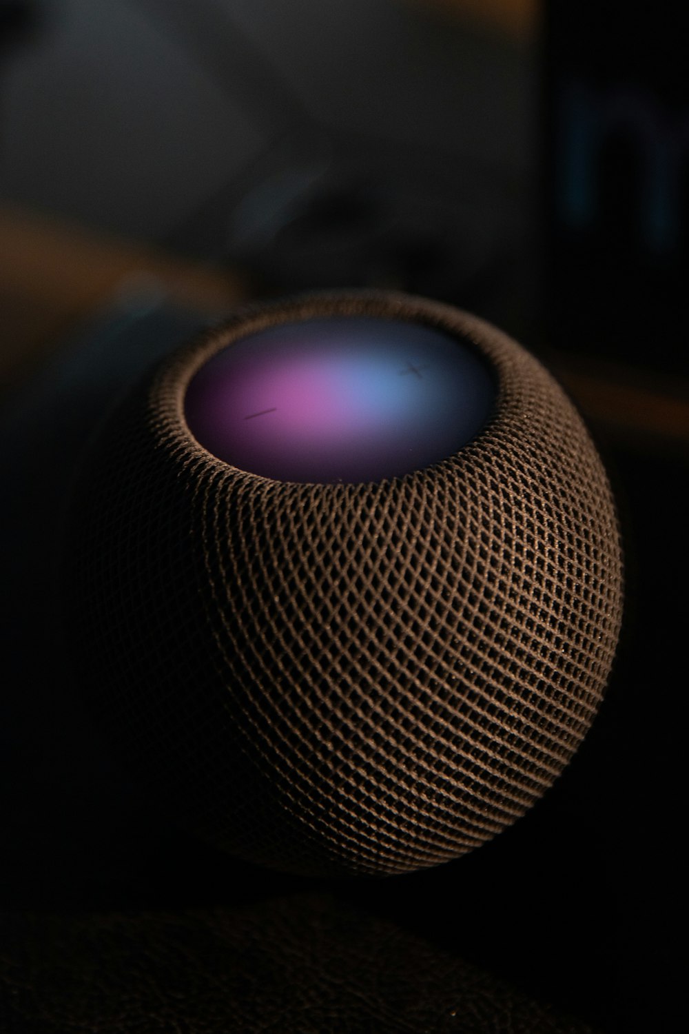 black and blue round portable speaker