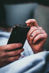 person holding black iphone 5