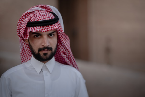 man in white dress shirt wearing red and white hijab