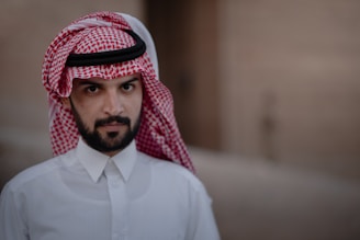 man in white dress shirt wearing red and white hijab