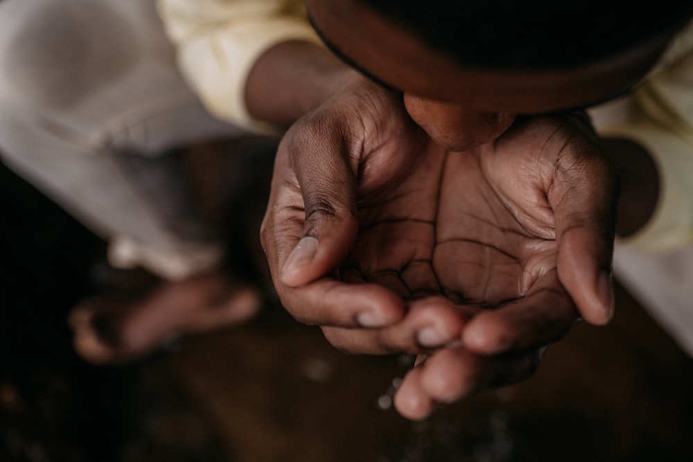 person holding babys hand