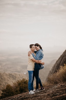 it's a yes,how to photograph man in blue denim jeans carrying woman in white long sleeve shirt