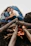 A happy couple enjoying camping under a starry sky with a cozy campfire.
