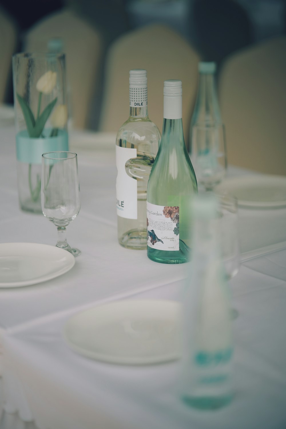 clear glass bottle on white table