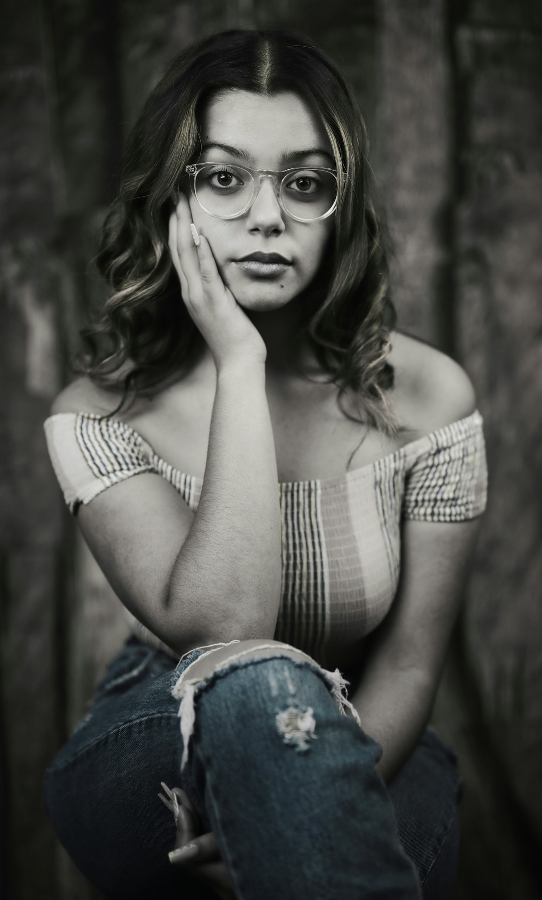 woman in white and black stripe tank top wearing black framed eyeglasses