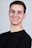 man in black crew neck shirt smiling