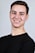 man in black crew neck shirt smiling