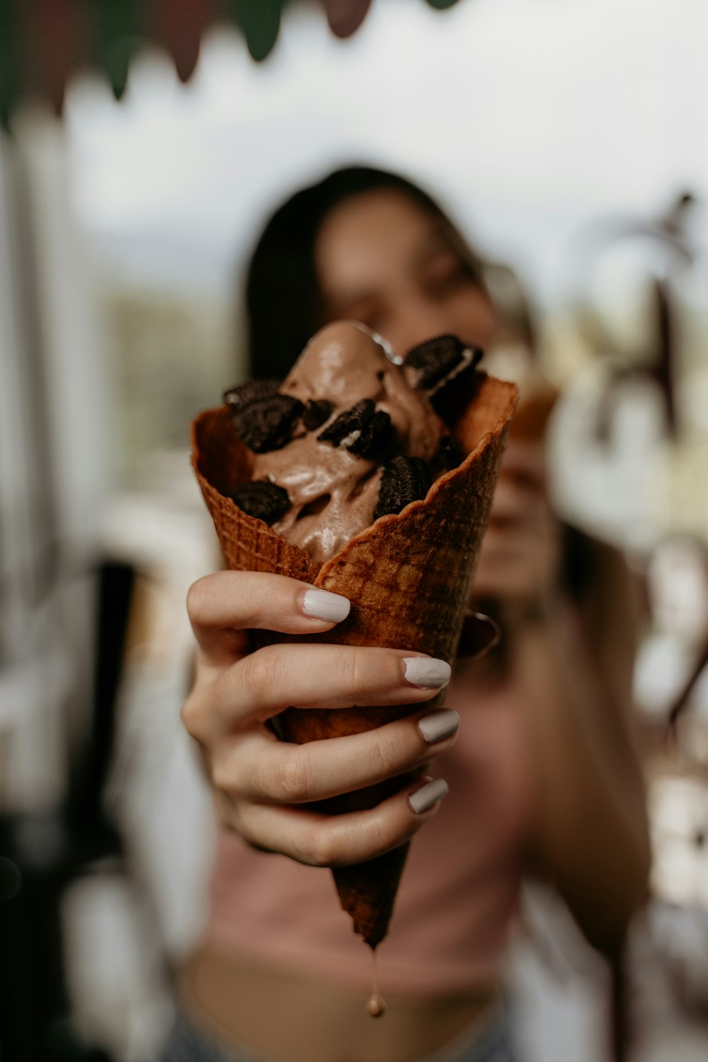 person holding ice cream cone