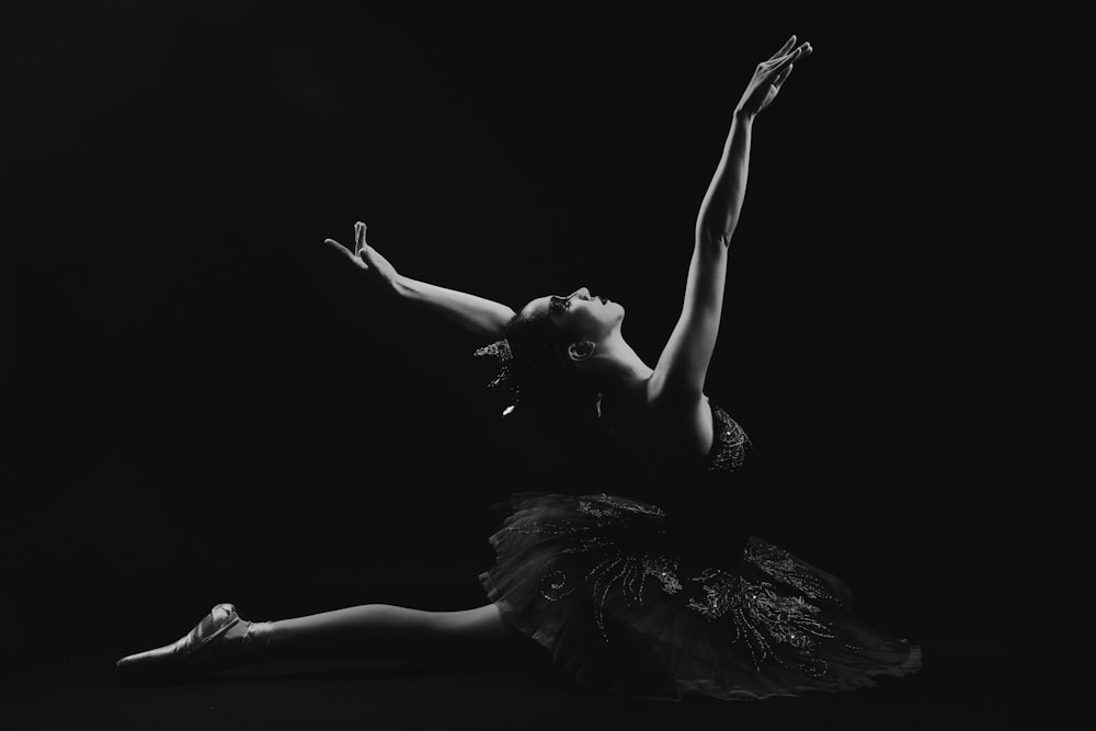 woman in black dress lying on floor