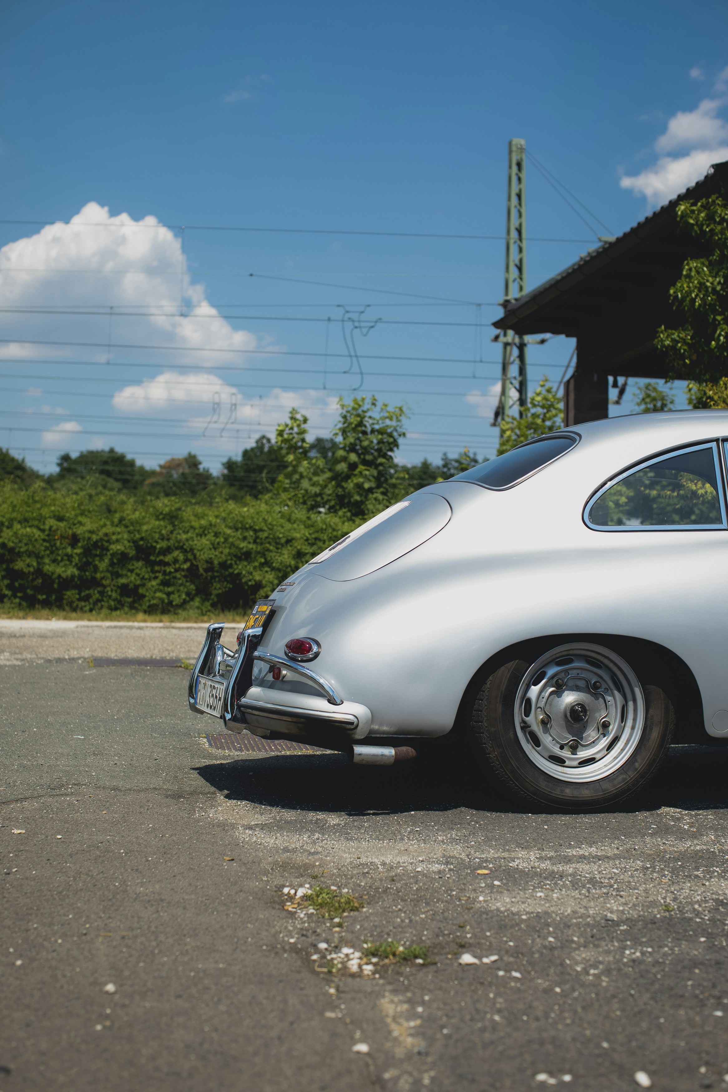 white volkswagen beetle parked on side of the road during daytime