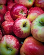red apple fruit in close up photography